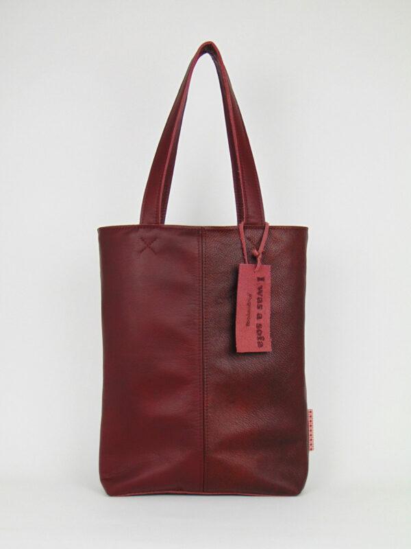 Product image of the shopper named Autumn Leaves. This shopper is made from recycled leather in a colour combination of two different burgundy red tones