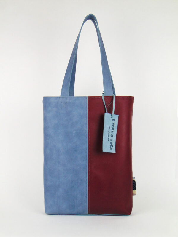 Product image of the shopper named Early Sunrise. This shopper is made from recycled leather in a colour combination of blue and red.