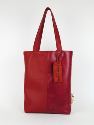 Product image of the shopper named Very Cherry. This shopper is made from recycled leather in a colour combination of red tones