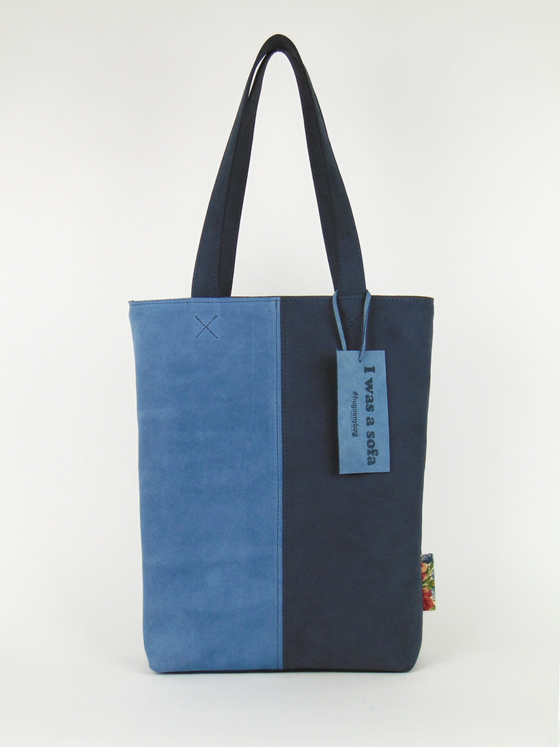 Product image of the shopper named Misty Evening Sky. This shopper is made from recycled suede in a colour combination of light blue and dark blue