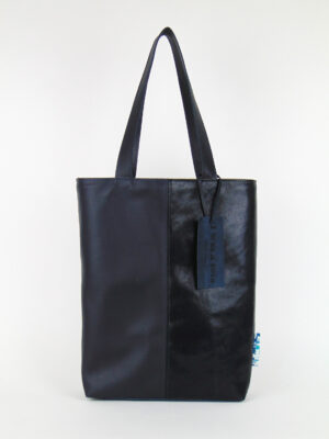 Product image of the shopper named Difficult Blue. This shopper is made from recycled leather in a colour combination of dark blue tones