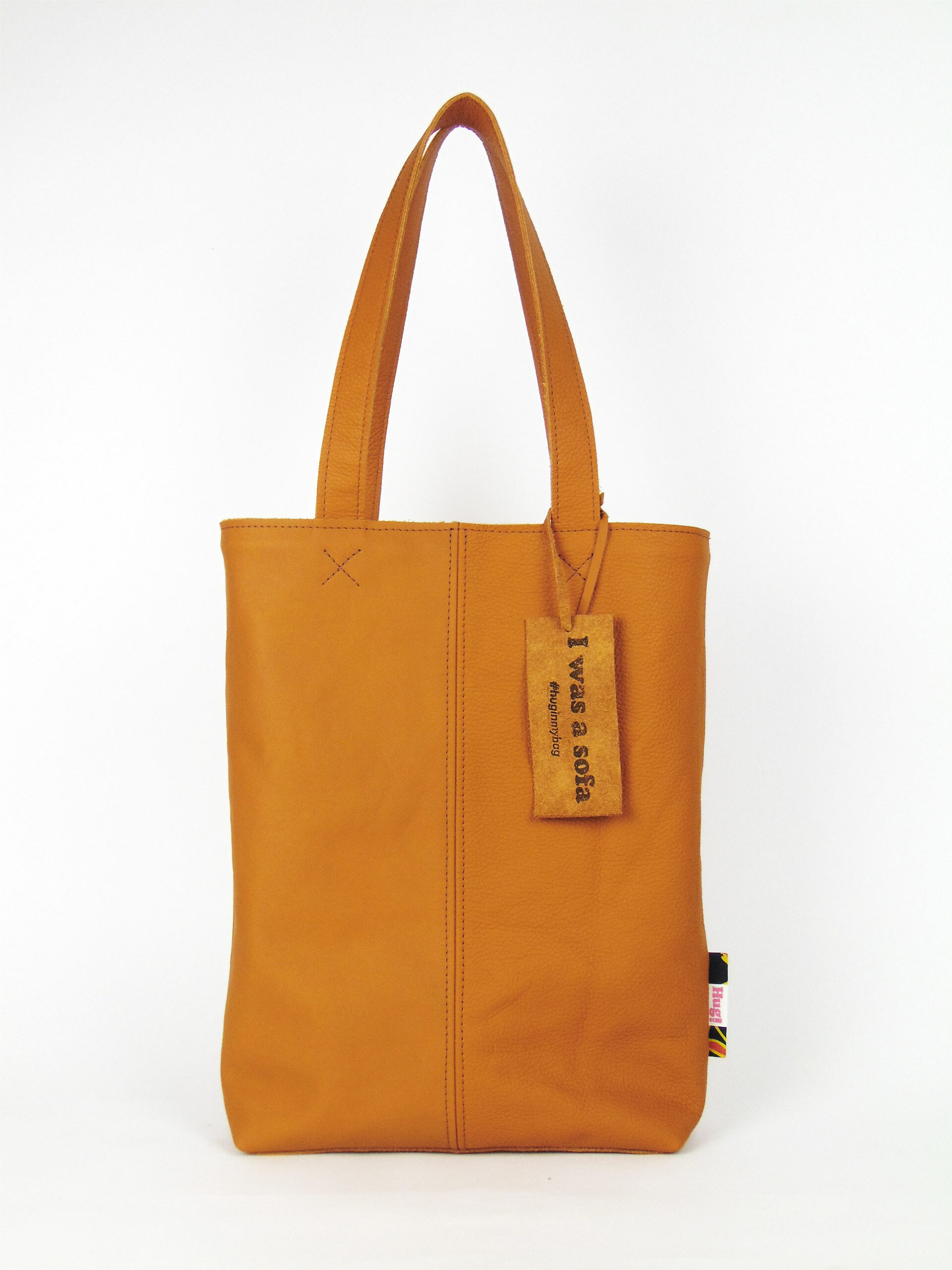Product image of the shopper named Hello Sunshine. This shopper is made from recycled leather in a colour combination of different shades of yellow.